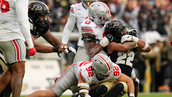 Ohio State Buckeyes linebacker Sonny Styles (0) and Ohio State Buckeyes defensive end Caden Curry (92) tackle Purdue Boilermakers running back Antonio Harris (22) during the NCAA football game at Ross-Ade Stadium in West Lafayette, Ind. on Nov. 8, 2025. Ohio State won 34-10. Ohio State Buckeyes linebacker Sonny Styles (0) and Ohio State Buckeyes defensive end Caden Curry (92) tackle Purdue Boilermakers running back Antonio Harris (22) during the NCAA football game at Ross-Ade Stadium in West Lafayette, Ind. on Nov. 8, 2025. Ohio State won 34-10.