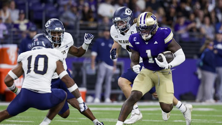 Sep 6, 2025; Seattle, Washington, USA; Washington Huskies running back Jonah Coleman (1) rushes against the UC Davis Aggies during the first quarter at Husky Stadium. Mandatory Credit: Joe Nicholson-Imagn Images