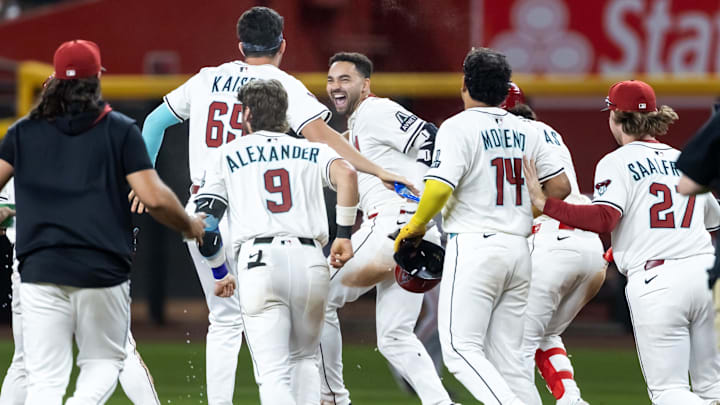 Sep 16, 2025; Phoenix, Arizona, USA; Arizona Diamondbacks infielder Jordan Lawlar celebrates with teammates after hitting an RBI walk off single in the ninth inning against the San Francisco Giants at Chase Field. Mandatory Credit: Mark J. Rebilas-Imagn Images Sep 16, 2025; Phoenix, Arizona, USA; Arizona Diamondbacks infielder Jordan Lawlar celebrates with teammates after hitting an RBI walk off single in the ninth inning against the San Francisco Giants at Chase Field. Mandatory Credit: Mark J. Rebilas-Imagn Images