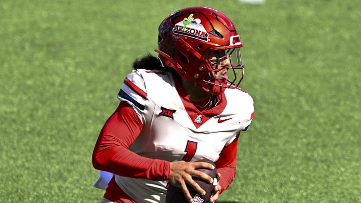 Oct 18, 2025; Houston, Texas, USA; Arizona Wildcats quarterback Noah Fifita (1) runs the ball during the first quarter against the Houston Cougars at TDECU Stadium. Mandatory Credit: Maria Lysaker-Imagn Images 