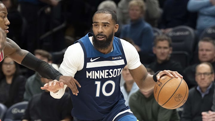 Jan 22, 2026; Minneapolis, Minnesota, USA; Minnesota Timberwolves guard Mike Conley (10) dribbles the ball against the Chicago Bulls in the first half at Target Center. Mandatory Credit: Jesse Johnson-Imagn Images