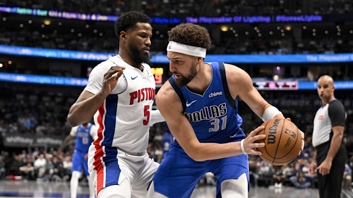 Mar 21, 2025; Dallas, Texas, USA; Dallas Mavericks guard Klay Thompson (31) looks to move the ball past Detroit Pistons guard Malik Beasley (5) during the first half at the American Airlines Center. Mandatory Credit: Jerome Miron-Imagn Images