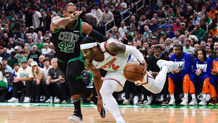 May 14, 2025; Boston, Massachusetts, USA; New York Knicks guard Miles McBride (2) controls the ball while Boston Celtics center Al Horford (42) defends in the first half during game five of the second round for the 2025 NBA Playoffs at TD Garden. Mandatory Credit: Bob DeChiara-Imagn Images