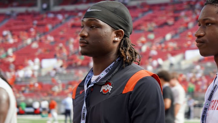 Sept. 21, 2024; Columbus, Ohio, USA; Glenville linebacker Cincere Johnson watches warm-ups before Ohio State's game against the Marshall University Thundering Herd at Ohio Stadium.