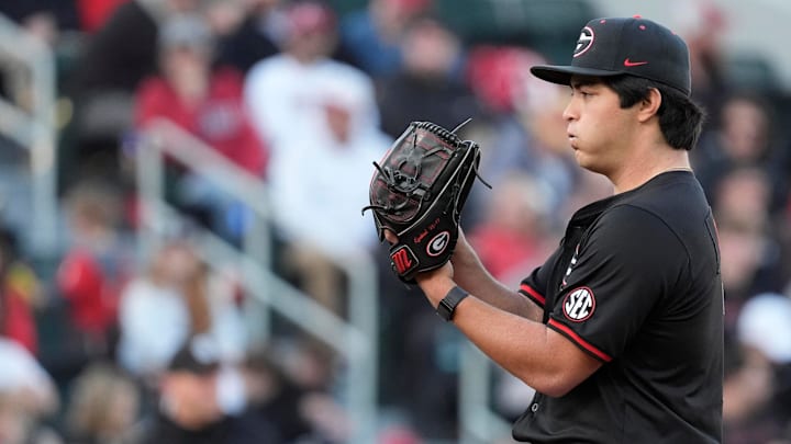 Georgia pitcher Brian Curley (7) gets set to throw a pitch during a NCAA baseball game against Arkansas in Athens, Ga., on Friday, April 11, 2025.