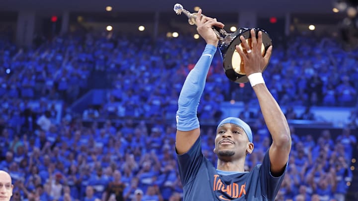 May 22, 2025; Oklahoma City, Oklahoma, USA; NBA commissioner is Adam Silver presents Oklahoma City Thunder guard Shai Gilgeous-Alexander (2) with the Michael Jordan Trophy for winning the most valuable player award for the 2024-25 season before game two of the western conference finals for the 2025 NBA Playoffs at Paycom Center. Mandatory Credit: Alonzo Adams-Imagn Images
