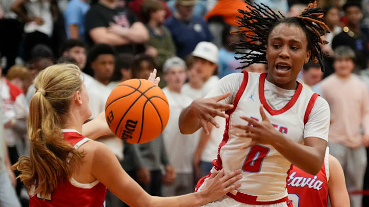 Vestavia Hills guard Grayson Hudgens (12) knocks the ball away from Hillcrest guard Skylynn Latham (0) at Hillcrest High School Tuesday, Dec. 10, 2024. Hillcrest downed Vestavia Hills 71-45.