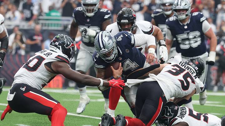 Oct 4, 2026; Houston, Texas, USA; Dallas Cowboys quarterback Dak Prescott (4) is tackled by Houston Texans linebacker Jake Hansen (35) during the first half at Reliant Stadium. Mandatory Credit: Troy Taormina-Imagn Images Oct 4, 2026; Houston, Texas, USA; Dallas Cowboys quarterback Dak Prescott (4) is tackled by Houston Texans linebacker Jake Hansen (35) during the first half at Reliant Stadium. Mandatory Credit: Troy Taormina-Imagn Images