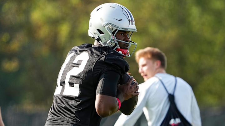 Aug 1, 2024; Columbus, OH, USA; Ohio State Buckeyes quarterback Air Noland (12) drops back to pass during football camp at the Woody Hayes Athletic Complex.