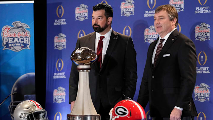 Dec 30, 2022; Atlanta, GA, USA;  Ohio State Buckeyes head coach Ryan Day and Georgia Bulldogs head coach Kirby Smart stand with the George P. Crumbley Trophy following a press conference prior to the Peach Bowl College Football Playoff semifinal at the Westin Hotel in Atlanta. Mandatory Credit: Adam Cairns-The Columbus Dispatch

Football Ohio State Georgia Coaches Press Conference