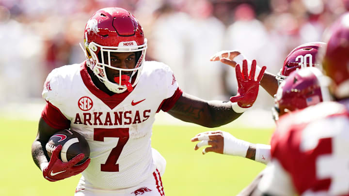 Oct 14, 2023; Tuscaloosa, Alabama, USA; Arkansas Razorbacks running back Rashod Dubinion (7) carries the ball against the Alabama Crimson Tide during the fourth quarter at Bryant-Denny Stadium. Mandatory Credit: John David Mercer-Imagn Images