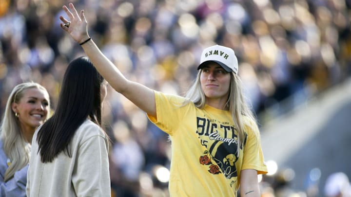 Iowa women’s basketball alumni Kate Martin waves to the crowd during an Iowa football game against Northwestern Saturday, Oct. 26, 2024 at Kinnick Stadium in Iowa City, Iowa.