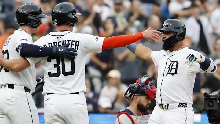 May 12, 2025; Detroit, Michigan, USA;  Detroit Tigers second base Gleyber Torres (25) celebrates with outfielder Kerry Carpenter (30) and second base Colt Keith (33) after he hits a two run home run first inning against the Boston Red Sox at Comerica Park.