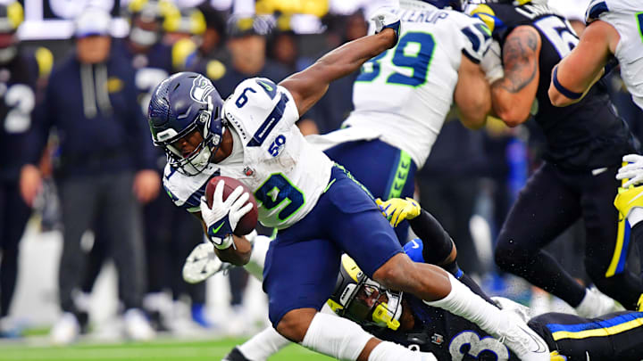 Nov 16, 2025; Inglewood, California, USA; Seattle Seahawks running back Kenneth Walker III (9) runs the ball against Los Angeles Rams safety Kam Curl (3) during the second half at SoFi Stadium. Mandatory Credit: Gary A. Vasquez-Imagn Images
