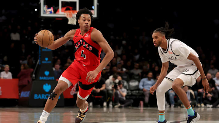 Mar 26, 2025; Brooklyn, New York, USA; Toronto Raptors forward Scottie Barnes (4) drives to the basket against Brooklyn Nets forward Ziaire Williams (8) during the fourth quarter at Barclays Center. Mandatory Credit: Brad Penner-Imagn Images