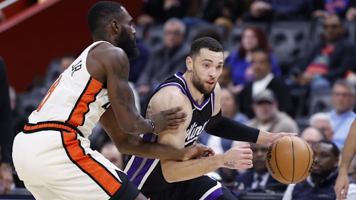 Apr 7, 2025; Detroit, Michigan, USA;  Sacramento Kings guard Zach LaVine (8) dribbles defended by Detroit Pistons forward Tim Hardaway Jr. (8) in the first half at Little Caesars Arena. Mandatory Credit: Rick Osentoski-Imagn Images