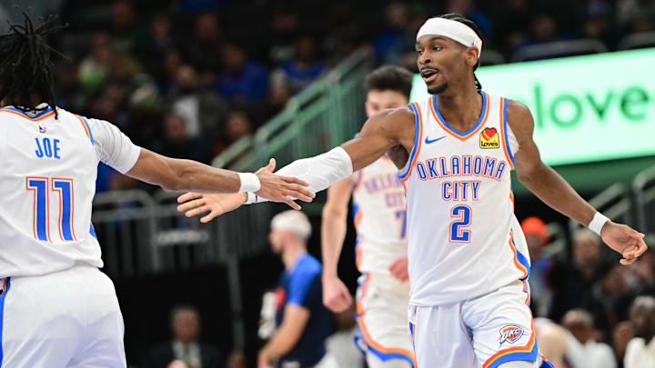 Mar 16, 2025; Milwaukee, Wisconsin, USA; Oklahoma City Thunder guard Shai Gilgeous-Alexander (2) celebrates with  guard Isaiah Joe (11) after score in the fourth quarter against the Milwaukee Bucks at Fiserv Forum. Mandatory Credit: Benny Sieu-Imagn Images
