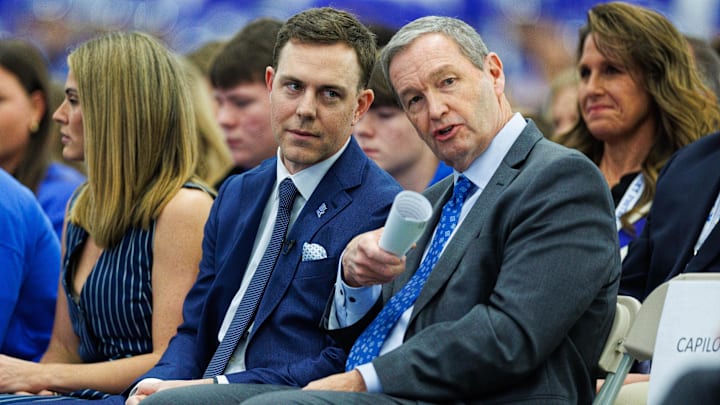 Dec 3, 2025; Lexington, KY, USA; Kentucky Wildcats athletic director Mitch Barnhart talks with head football coach Will Stein during his introductory press conference at Nutter Field House. Mandatory Credit: Jordan Prather-Imagn Images