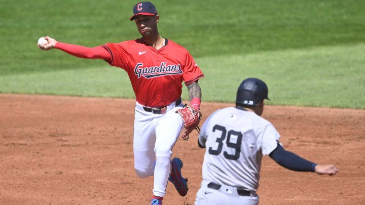 Apr 13, 2024; Cleveland, Ohio, USA; Cleveland Guardians shortstop Brayan Rocchio (4) turns a double play beside New York Yankees catcher Jose Trevino (39) in the second inning at Progressive Field. Mandatory Credit: David Richard-USA TODAY Sports Apr 13, 2024; Cleveland, Ohio, USA; Cleveland Guardians shortstop Brayan Rocchio (4) turns a double play beside New York Yankees catcher Jose Trevino (39) in the second inning at Progressive Field. Mandatory Credit: David Richard-USA TODAY Sports