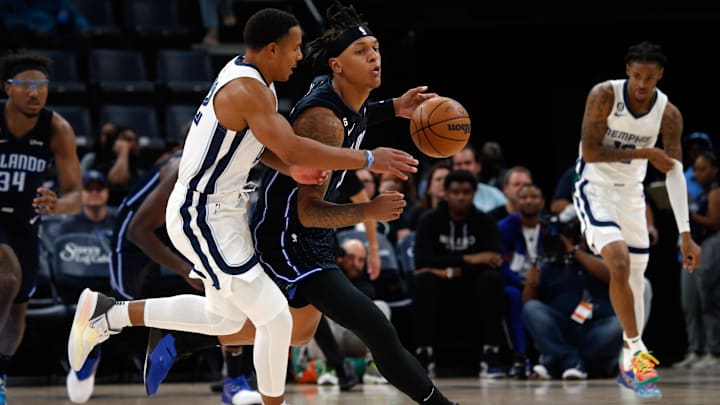 Oct 3, 2022; Memphis, Tennessee, USA; Orlando Magic forward Paolo Banchero (5) steals the ball from Memphis Grizzlies guard Desmond Bane (22) during the first half at FedExForum. Mandatory Credit: Petre Thomas-Imagn Images