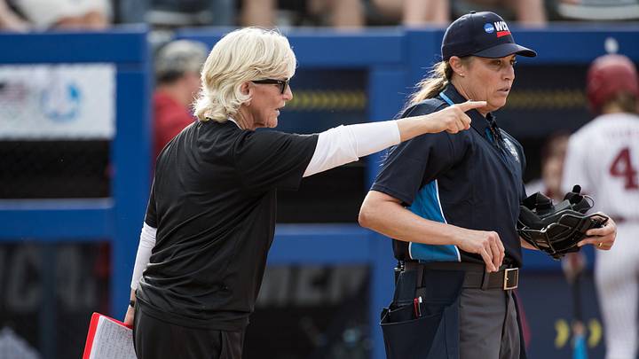 May 30, 2026; Oklahoma City, OK, USA; Nebraska Cornhuskers head coach Rhonda Revelle points towards second base as she discusses a call with an umpire in the second inning against the Alabama Crimson Tide during the NCAA Women’s College World Series at Devon Park. May 30, 2026; Oklahoma City, OK, USA; Nebraska Cornhuskers head coach Rhonda Revelle points towards second base as she discusses a call with an umpire in the second inning against the Alabama Crimson Tide during the NCAA Women’s College World Series at Devon Park.