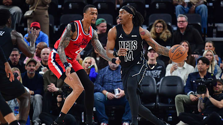 Jan 25, 2026; Inglewood, California, USA; Brooklyn Nets guard Terance Mann (14) moves to the basket against Los Angeles Clippers forward John Collins (20) during the first half at Intuit Dome. Mandatory Credit: Gary A. Vasquez-Imagn Images