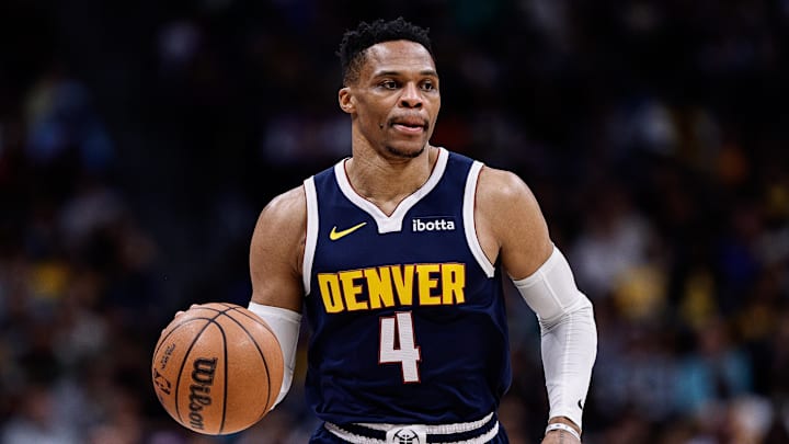 Mar 14, 2025; Denver, Colorado, USA; Denver Nuggets guard Russell Westbrook (4) controls the ball in the first quarter against the Los Angeles Lakers at Ball Arena. Mandatory Credit: Isaiah J. Downing-Imagn Images