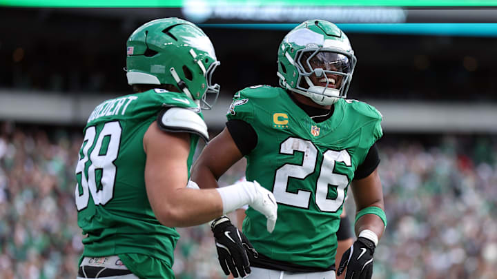 Oct 26, 2025; Philadelphia, Pennsylvania, USA; Philadelphia Eagles tight end Dallas Goedert (88) celebrates scoring a touchdown with running back Saquon Barkley (26) in the second quarter against the New York Giants at Lincoln Financial Field. Mandatory Credit: Bill Streicher-Imagn Images