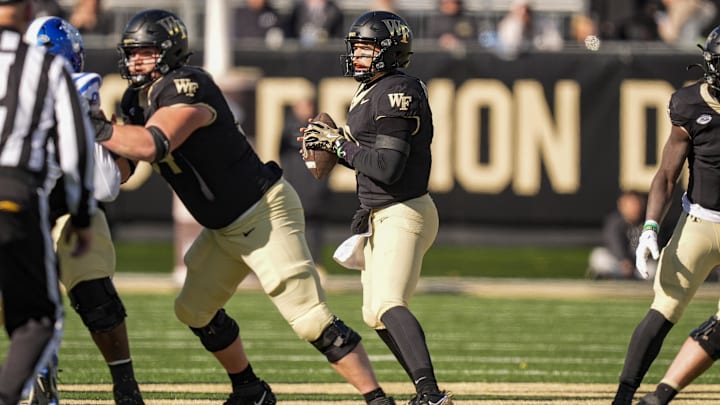 Nov 30, 2024; Winston-Salem, North Carolina, USA;  Wake Forest Demon Deacons quarterback Hank Bachmeier (9) drops back to pass against the Duke Blue Devils during the first half at Allegacy Federal Credit Union Stadium. Mandatory Credit: Jim Dedmon-Imagn Images