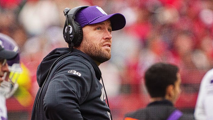 Oct 25, 2025; Lincoln, Nebraska, USA; Northwestern Wildcats head coach David Braun watches a replay during the second quarter against the Nebraska Cornhuskers at Memorial Stadium. Oct 25, 2025; Lincoln, Nebraska, USA; Northwestern Wildcats head coach David Braun watches a replay during the second quarter against the Nebraska Cornhuskers at Memorial Stadium.