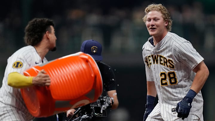 Milwaukee Brewers shortstop Willy Adames (27) dumps gatorade on center fielder Joey Wiemer (28) after he hit a sacrifice fly to Kansas City Royals center fielder Jackie Bradley Jr. (41) allowing Brewers right fielder Brian Anderson (9) to score during the ninth inning on Saturday May 13, 2023 at American Family Field in Milwaukee, Wis.
