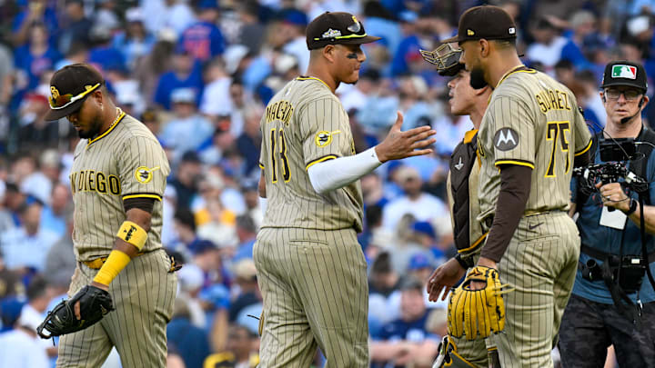 Oct 1, 2025; Chicago, Illinois, USA; San Diego Padres relief pitcher Robert Suarez (75) celebrates with teammates after the final out for the win against the Chicago Cubs in the ninth inning during game two of the Wildcard round for the 2025 MLB playoffs at Wrigley Field. Mandatory Credit: Matt Marton-Imagn Images