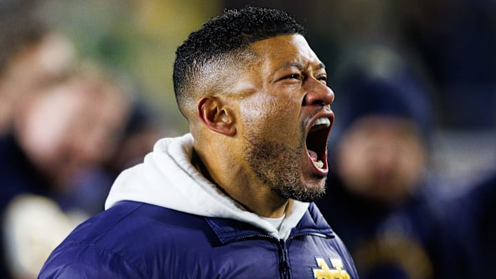 Notre Dame head coach Marcus Freeman celebrates after winning the first round of the College Football Playoff 27-17 against Indiana at Notre Dame Stadium on Friday, Dec. 20, 2024, in South Bend. Notre Dame head coach Marcus Freeman celebrates after winning the first round of the College Football Playoff 27-17 against Indiana at Notre Dame Stadium on Friday, Dec. 20, 2024, in South Bend.