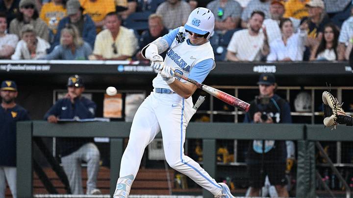Jun 14, 2026; Omaha, NE, USA;  North Carolina Tar Heels center fielder Owen Hull (8) singles in a run against the West Virginia Mountaineers during the seventh inning at Charles Schwab Field. Mandatory Credit: Steven Branscombe-Imagn Images
