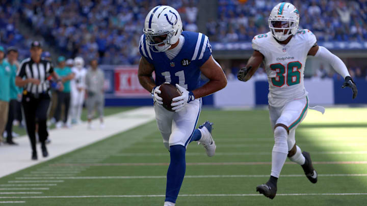 Sep 7, 2025; Indianapolis, Indiana, USA; Indianapolis Colts wide receiver Michael Pittman Jr. (11) catches a touchdown against Miami Dolphins cornerback Storm Duck (36) during the first half at Lucas Oil Stadium. Mandatory Credit: Trevor Ruszkowski-Imagn Images