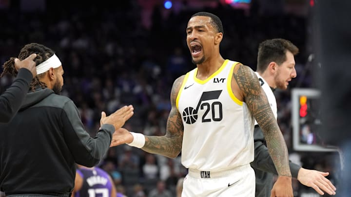 Dec 8, 2024; Sacramento, California, USA; Utah Jazz forward John Collins (20) slaps hands with guard Patty Mills (left) during the third quarter against the Sacramento Kings at Golden 1 Center. Mandatory Credit: Darren Yamashita-Imagn Images