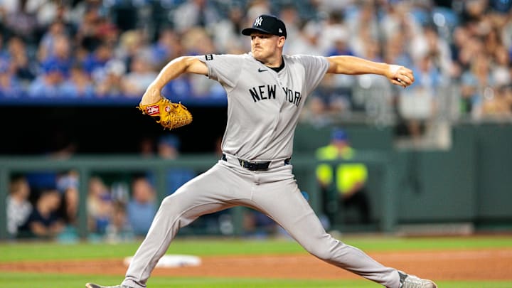 Jun 11, 2025; Kansas City, Missouri, USA; New York Yankees pitcher Brent Headrick (47) pitches during the eighth inning against the Kansas City Royals  at Kauffman Stadium. Mandatory Credit: William Purnell-Imagn Images