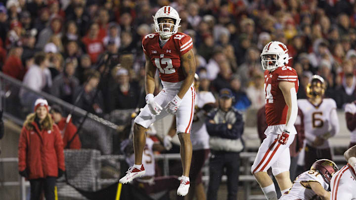 Nov 26, 2022; Madison, Wisconsin, USA;  Wisconsin Badgers cornerback Max Lofy (12) celebrates following a tackle during the third quarter against the Minnesota Golden Gophers at Camp Randall Stadium.