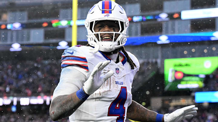 Dec 14, 2025; Foxborough, Massachusetts, USA; Buffalo Bills running back James Cook III (4) reacts after scoring a touchdown against the New England Patriots during the second half at Gillette Stadium. Dec 14, 2025; Foxborough, Massachusetts, USA; Buffalo Bills running back James Cook III (4) reacts after scoring a touchdown against the New England Patriots during the second half at Gillette Stadium.