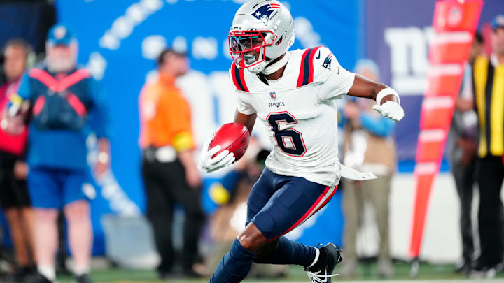 New England Patriots wide receiver Javon Baker (6) runs with the punt return in the first quarter, Thursday, August 21, 2025, in East Rutherford.