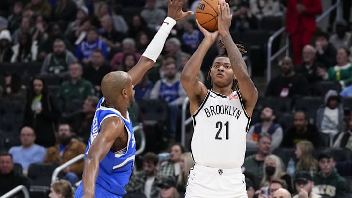 Dec 26, 2024; Milwaukee, Wisconsin, USA; Brooklyn Nets forward Noah Clowney (21) shoots under pressure from Milwaukee Bucks forward Khris Middleton (22) during the third quarter at Fiserv Forum. Mandatory Credit: Jeff Hanisch-Imagn Images Dec 26, 2024; Milwaukee, Wisconsin, USA; Brooklyn Nets forward Noah Clowney (21) shoots under pressure from Milwaukee Bucks forward Khris Middleton (22) during the third quarter at Fiserv Forum. Mandatory Credit: Jeff Hanisch-Imagn Images