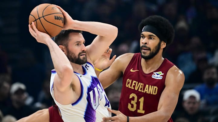 Jan 12, 2026; Cleveland, Ohio, USA; Cleveland Cavaliers center Jarrett Allen (31) defends Utah Jazz forward Kevin Love (42) during the first half at Rocket Arena. Mandatory Credit: Ken Blaze-Imagn Images