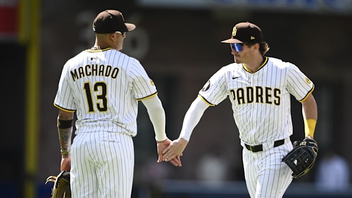 Jun 25, 2025; San Diego, California, USA; San Diego Padres center fielder Tyler Wade (14), right, and Manny Machado (13) celebrate after the Padres beat the Washington Nationals 1-0 at Petco Park. Mandatory Credit: Denis Poroy-Imagn Images
