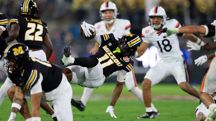 Missouri Tigers wide receiver Damarion Fowlkes (11) spins on a kickoff return during the third quarter of the TaxSlayer Gator Bowl at EverBank Stadium, Saturday, Dec. 27, 2025, in Jacksonville. Fla. Virginia defeated the Missouri 13-7. [Corey Perrine/Florida Times-Union]