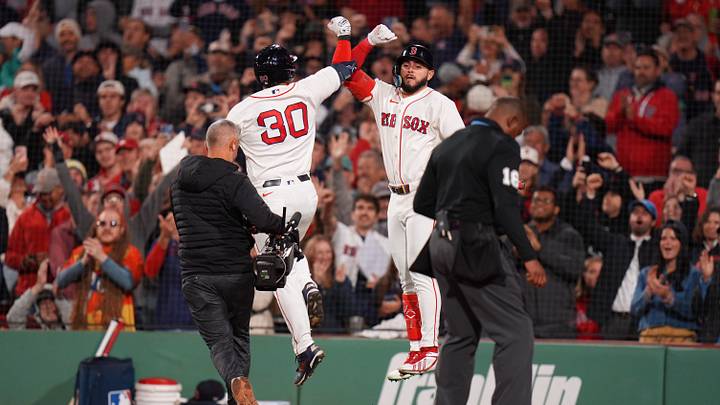 Boston Red Sox designated hitter Mickey Gasper (30) is congratulated after hitting a home run.