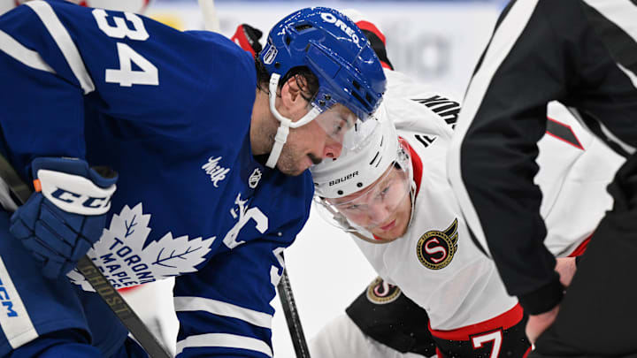 Apr 22, 2025; Toronto, Ontario, CAN;  Toronto Maple Leafs forward Auston Matthews (34) and Ottawa Senators forward Brady Tkachuk (7) line up for a face off in the second period in game two of the first round of the 2025 Stanley Cup Playoffs at Scotiabank Arena. Mandatory Credit: Dan Hamilton-Imagn Images