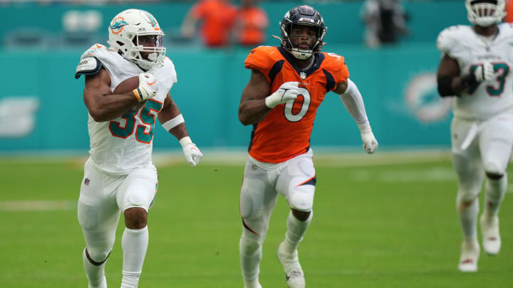 Chris Brooks (35) breaks free for a big gain during the fourth quarter of the Dolphins' 70-20 victory against Denver at Hard Rock Stadium in Miami Gardens last season.