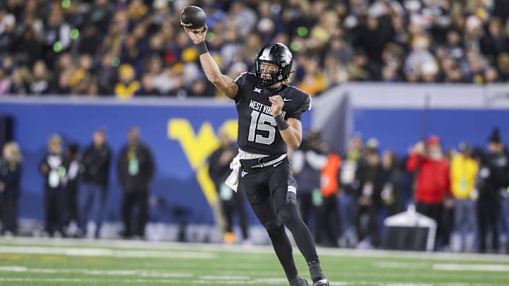Oct 25, 2025; Morgantown, West Virginia, USA; West Virginia Mountaineers quarterback Scotty Fox Jr. (15) throws a pass during the first quarter against the Texas Christian University Horned Frogs at Milan Puskar Stadium. Mandatory Credit: Ben Queen-Imagn Images