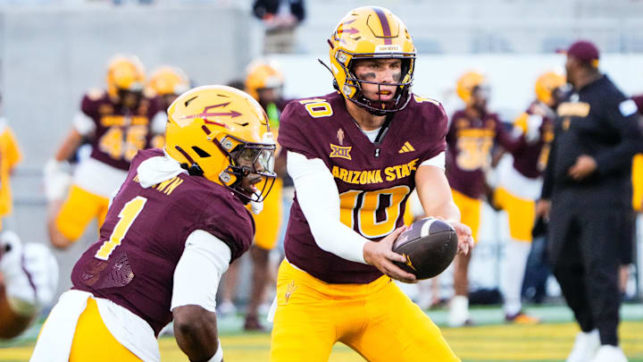 Aug 30, 2025; Tempe, Arizona, USA; Arizona State Sun Devils quarterback Sam Leavitt (10) hands off the ball to Arizona State Sun Devils running back Kyson Brown (1) during warm ups before the game against the Northern Arizona Lumberjacks at Mountain America Stadium. Mandatory Credit: Arianna Grainey-Imagn Images