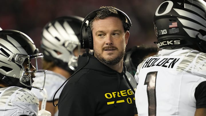 Nov 16, 2024; Madison, Wisconsin, USA;  Oregon Ducks head coach Dan Lanning looks on during the third quarter against the Wisconsin Badgers at Camp Randall Stadium. Mandatory Credit: Jeff Hanisch-Imagn Images